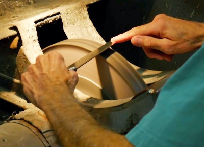 Knife Maker Sharpening on a Wheel